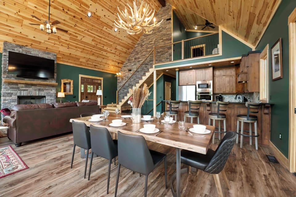 Dining area seats 8- which opens to the kitchen with bar seating for 4.