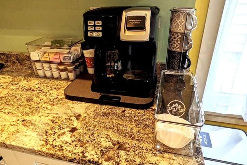 K-cup single serve or 12-cup coffee pot. K-cups, tea and local coffee provided.