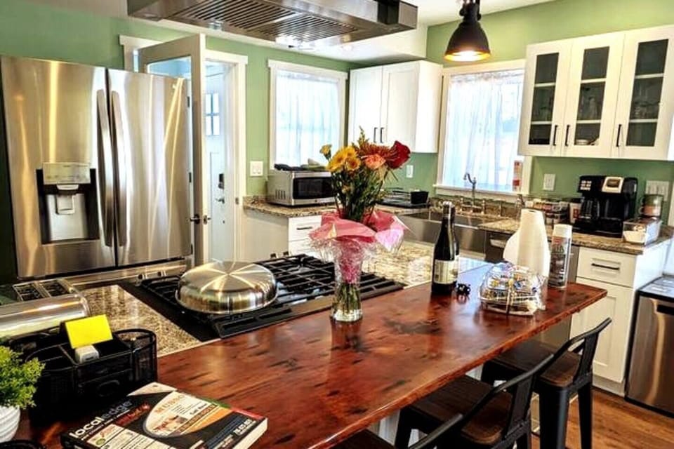 Rear Cottage Kitchen & Bar. Filtered water dispenser and ice maker, steam dishwasher, gas stove, lighted exhaust stove hood. Microwave, 4-slice toaster, electric kettle, non-stick, stainless and cast-iron cookware.