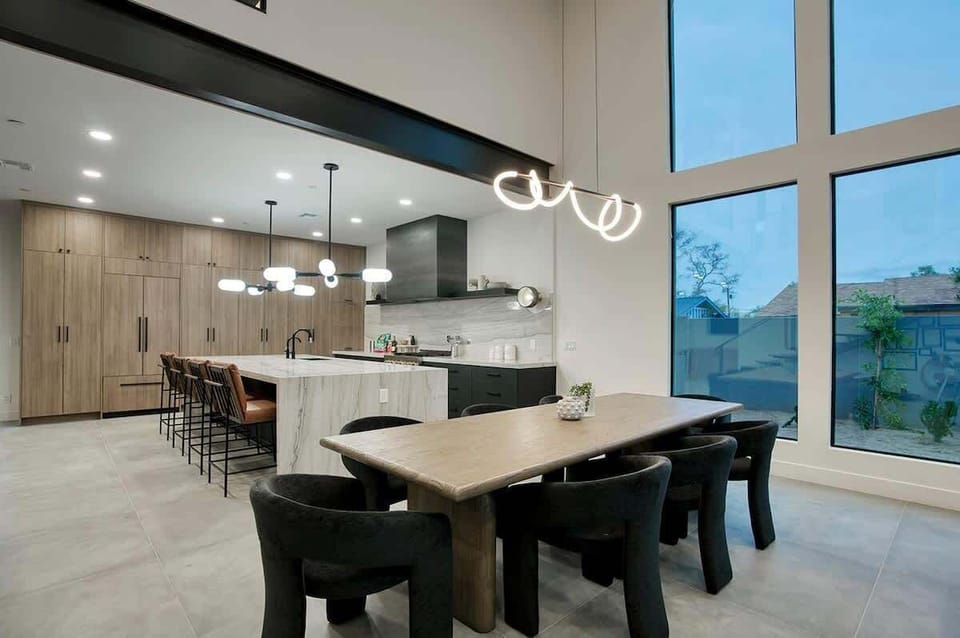 Bright dining space with skylight and seating for the whole group.