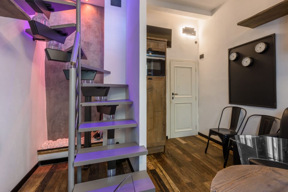 City Apartment | Living area | 40-inch flat-screen TV with digital channels