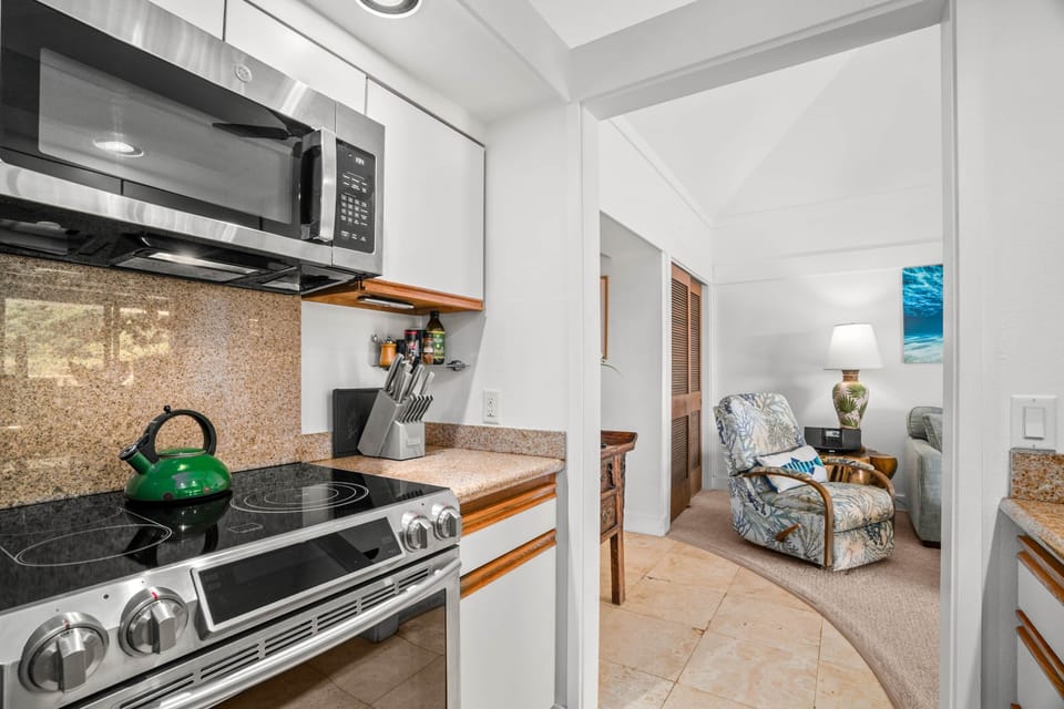Kitchen - Step into this cozy kitchen, where modern appliances meet a touch of nature. 