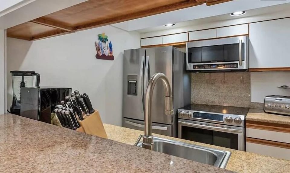 Kitchen - Step into this cozy kitchen, where modern appliances meet a touch of nature. 