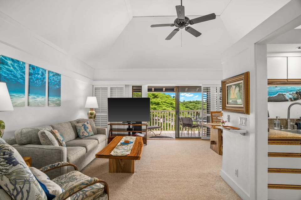 Living Room Facing Lanai-Discover your dream getaway in this stunning open-concept living space.