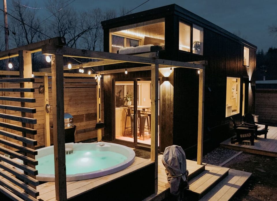 An artful, romantic tiny home featuring a dreamy loft and private hot tub.