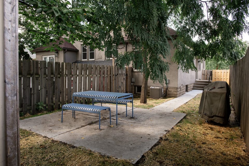Your private, fenced in back yard with shade and a gas grill to enjoy your stay in the cottage.