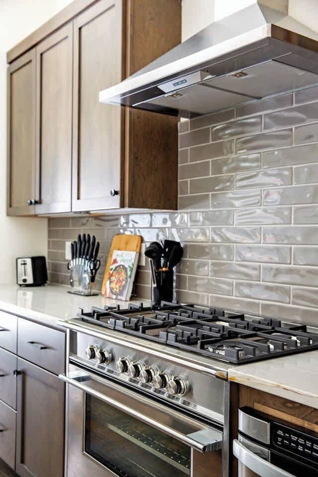 Functional and elegant kitchen with stainless appliances and wooden cabinetry.