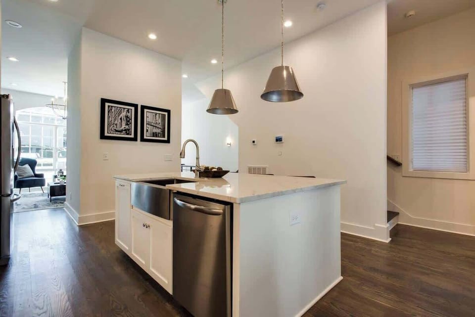 Dishwasher integrated into the island counter for convenience.