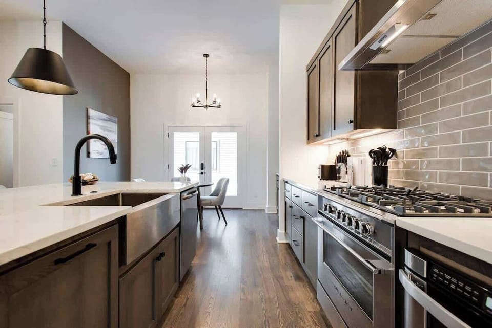 A chef’s dream kitchen with stainless steel appliances and warm wooden cabinets.