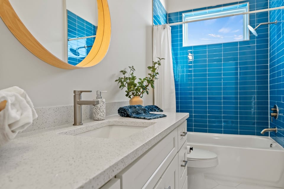 The shared upstairs bathroom is a tub/shower combo