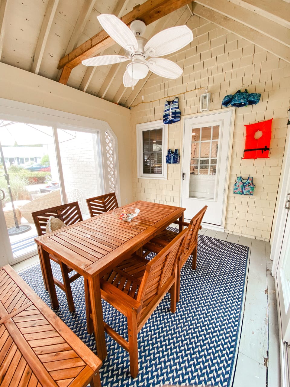 fully screened sun porch with eat in dining