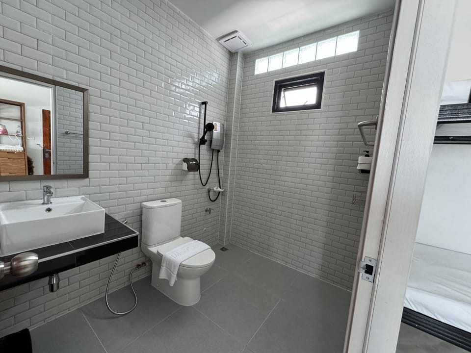 Family Room, Multiple Beds, Lanai | Bathroom | Slippers, towels, soap, shampoo