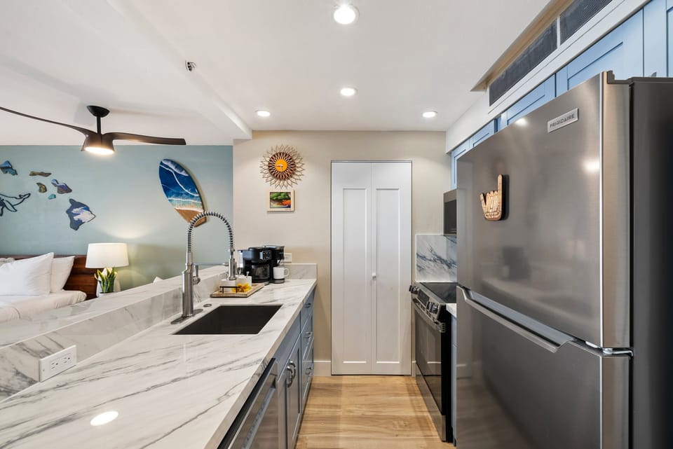 Elegant kitchen layout with sleek finishes and a seamless connection to the rest of the suite