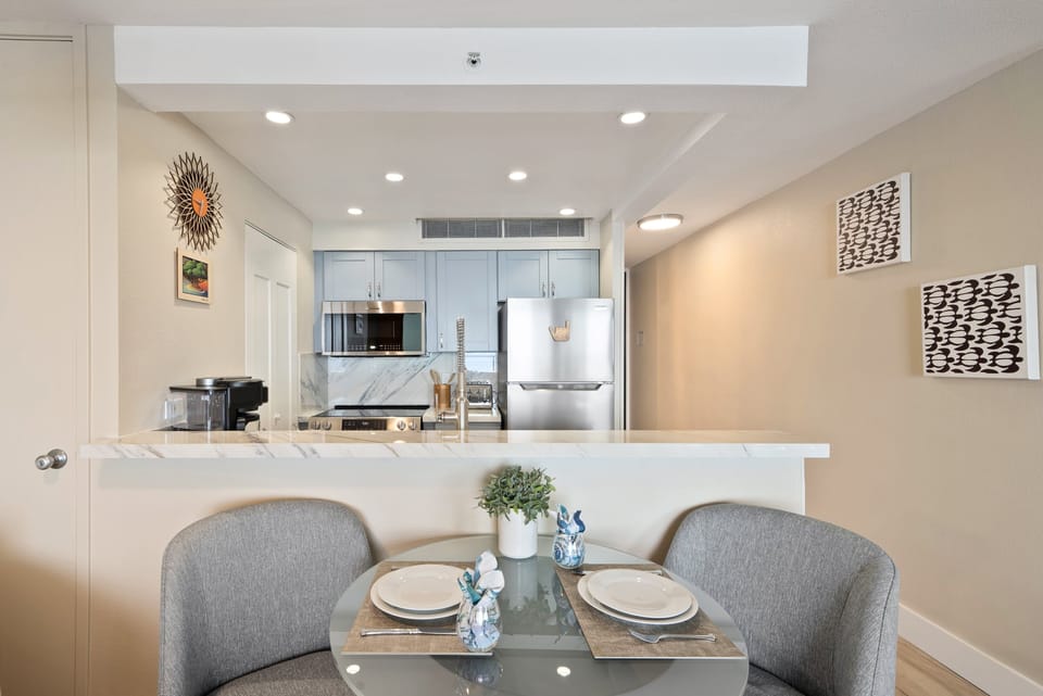 Stylish dining area ideal for enjoying meals or coffee with a view of the open kitchen