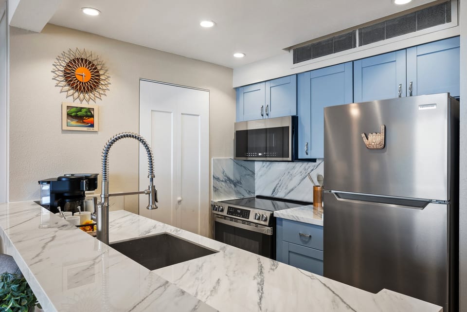 Fully equipped kitchen featuring modern finishes and a spacious layout for easy meal prep