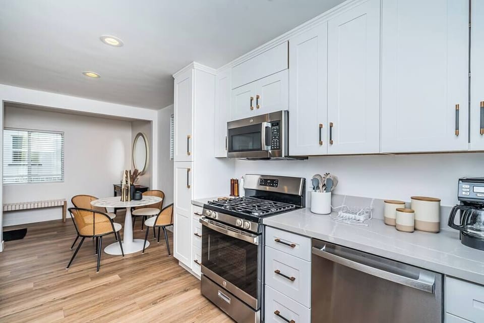 Embrace seamless living in our open floor plan retreat, where every meal, memory, and moment seamlessly unfolds between the dining, living room, and kitchen.