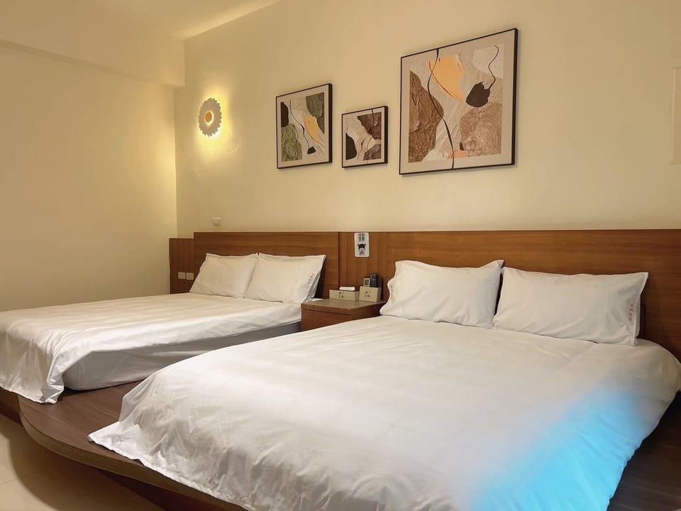 Deluxe Quadruple Room, City View | Pillowtop beds, free WiFi