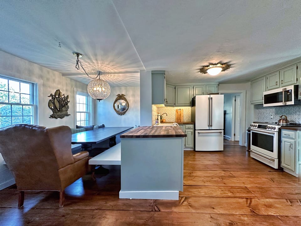 View of open kitchen/custom dining space. dining for 8 people