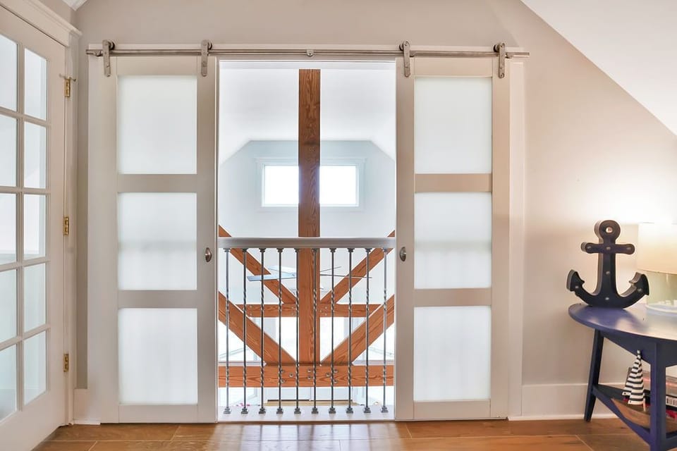 Privacy sliders overlooking living room from bunk room