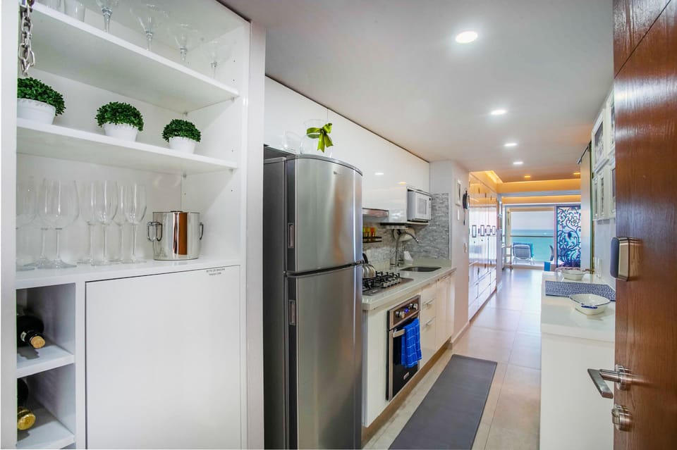 The kitchen is well-stocked with multiple glass wines for a delightful evening