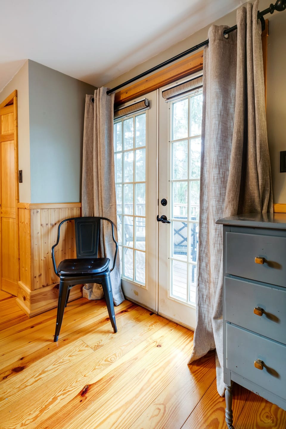 Bedroom access to spacious deck with lounge furniture.
