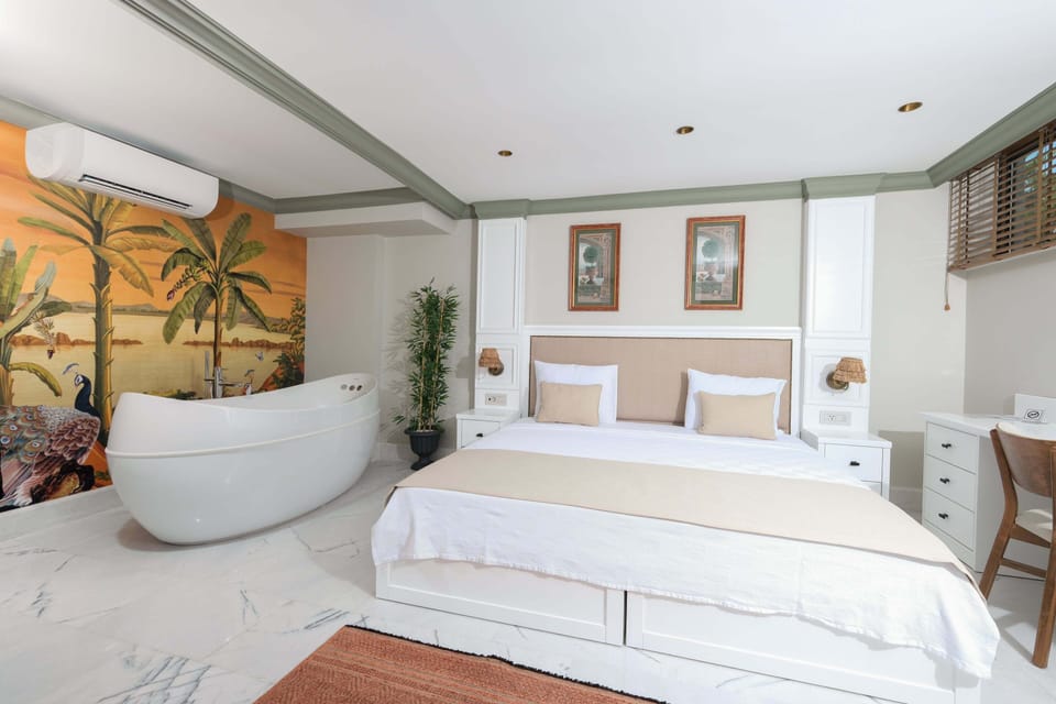 Deluxe Room, Hot Tub, Pool View | Minibar, in-room safe, free WiFi, bed sheets