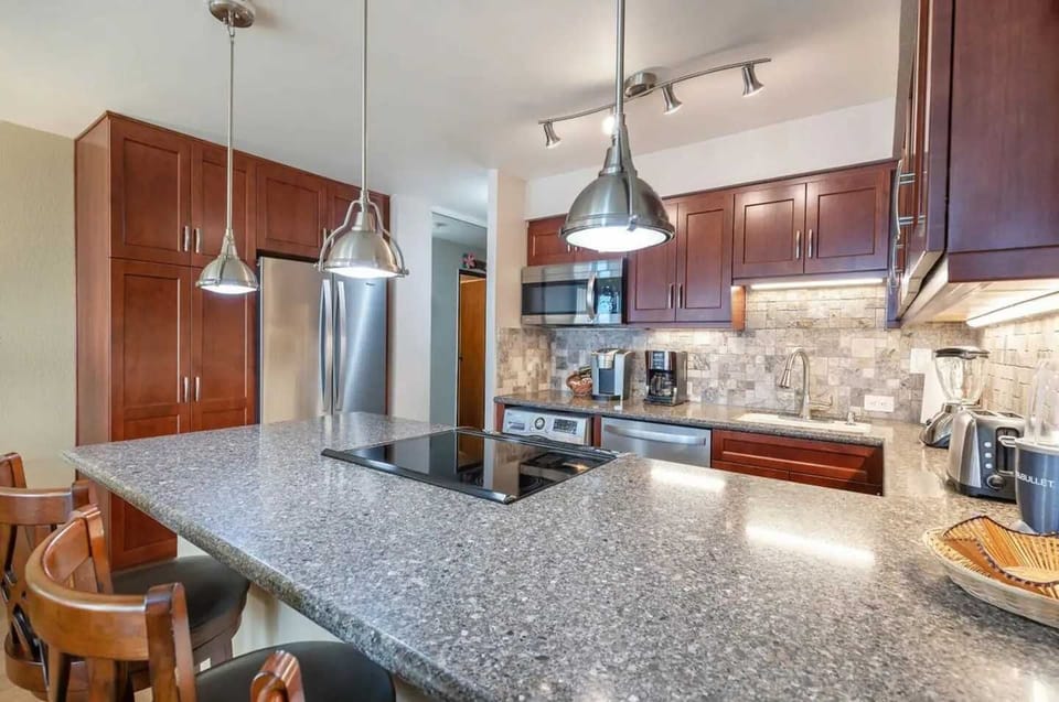 Remodeled Kitchen W/Spacious Pantry. Microwave, Blender, Coffee maker, Keurig, Toaster, Compact washer/dryer, Icemaker, Filtered cold water inside full size refrigerator, dishwasher and oven/stovetop. Full range of kitchen cooking accessories.