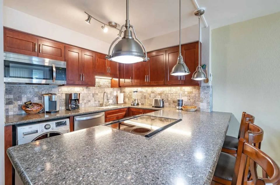 Remodeled Kitchen W/Spacious Pantry. Microwave, Blender, Coffee maker, Keurig, Toaster, Compact washer/dryer, Icemaker, Filtered cold water inside full size refrigerator, dishwasher and oven/stovetop. Full range of kitchen cooking accessories.