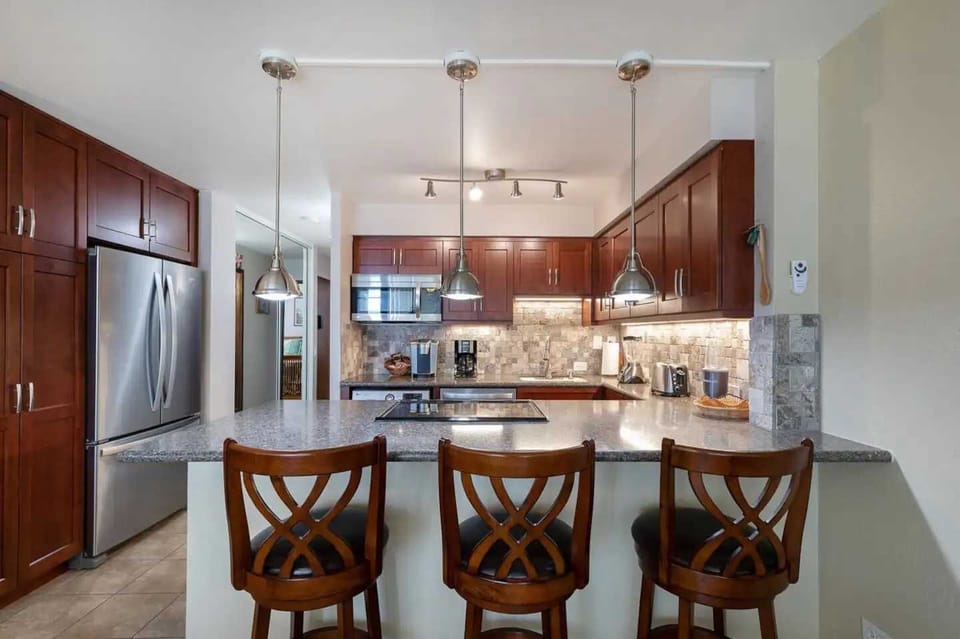 Remodeled Kitchen W/Spacious Pantry. Microwave, Blender, Coffee maker, Keurig, Toaster, Compact washer/dryer, Icemaker, Filtered cold water inside full size refrigerator, dishwasher and oven/stovetop. Full range of kitchen cooking accessories.