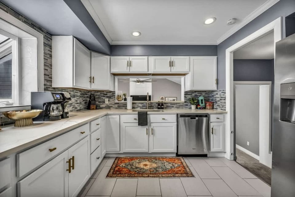 A well-equipped kitchen that beckons culinary adventures with its sleek appliances, ample counter space, and charming dining area.
