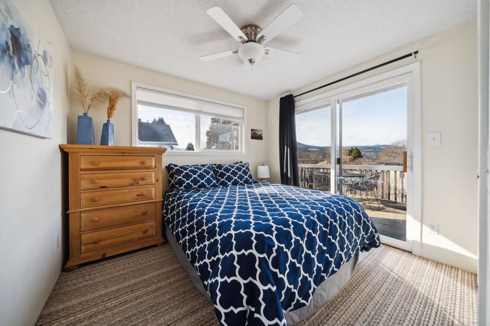 Second bedroom.  Queen bed.  View of river and Mt. Adams