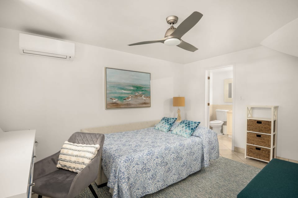 Den with double bed, and work desk