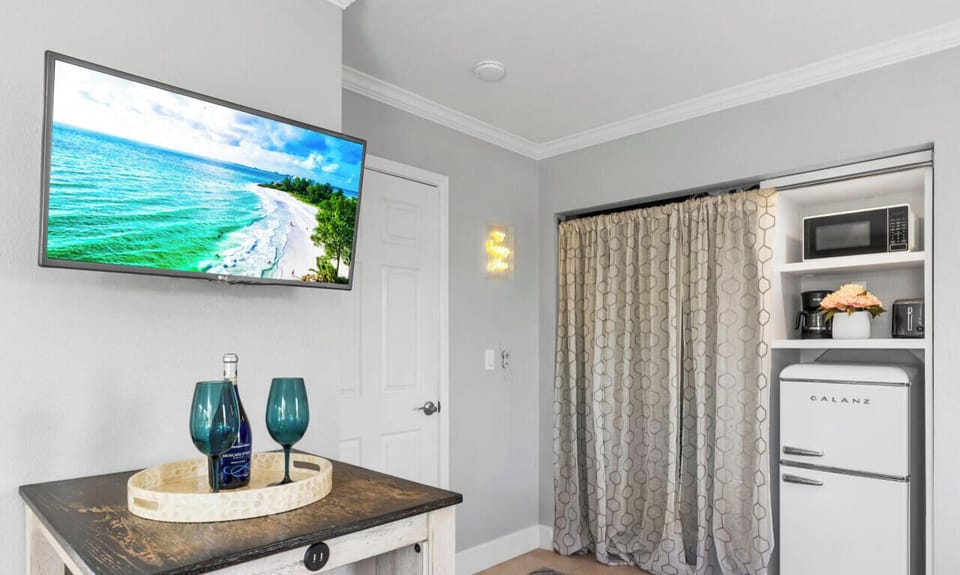 Complementary beverage, HDTV, and closet for storage or clothing