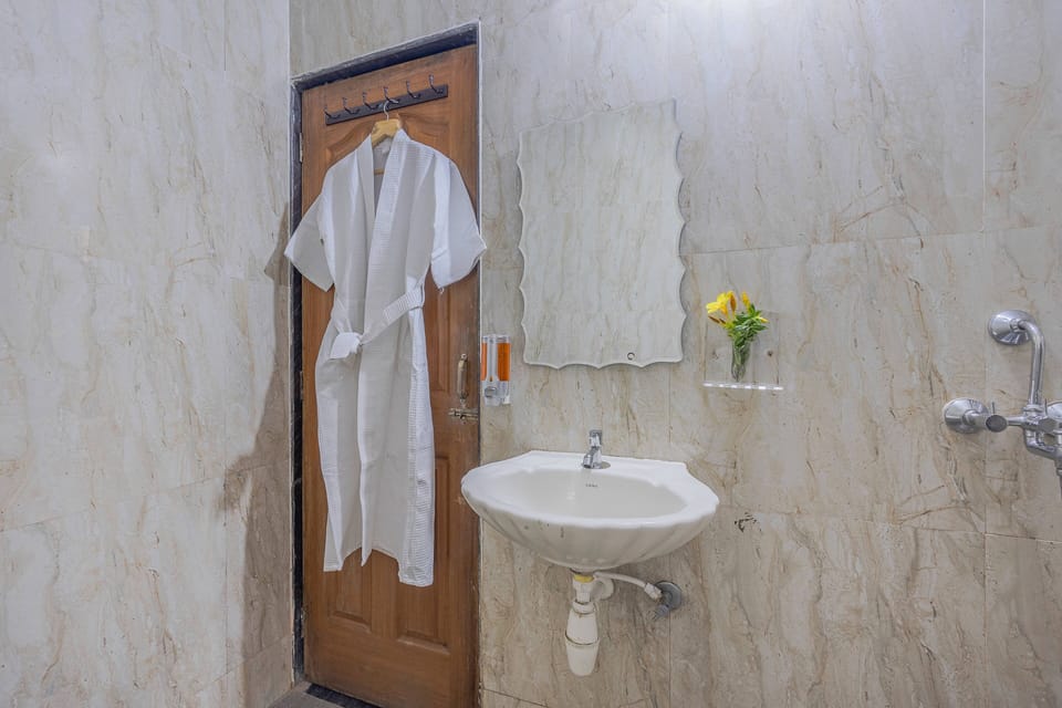 Family Apartment, 2 Bedrooms, Courtyard View, Ground Floor | Bathroom | Shower, free toiletries, towels