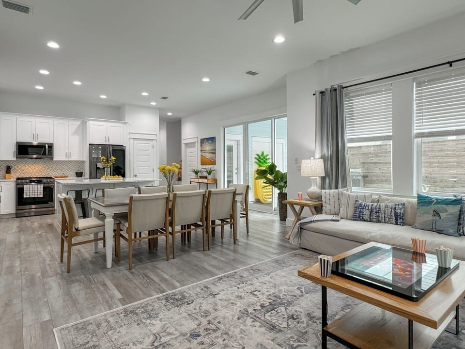 Elegant coastal interiors paired with refined finishes and inviting gathering spaces.