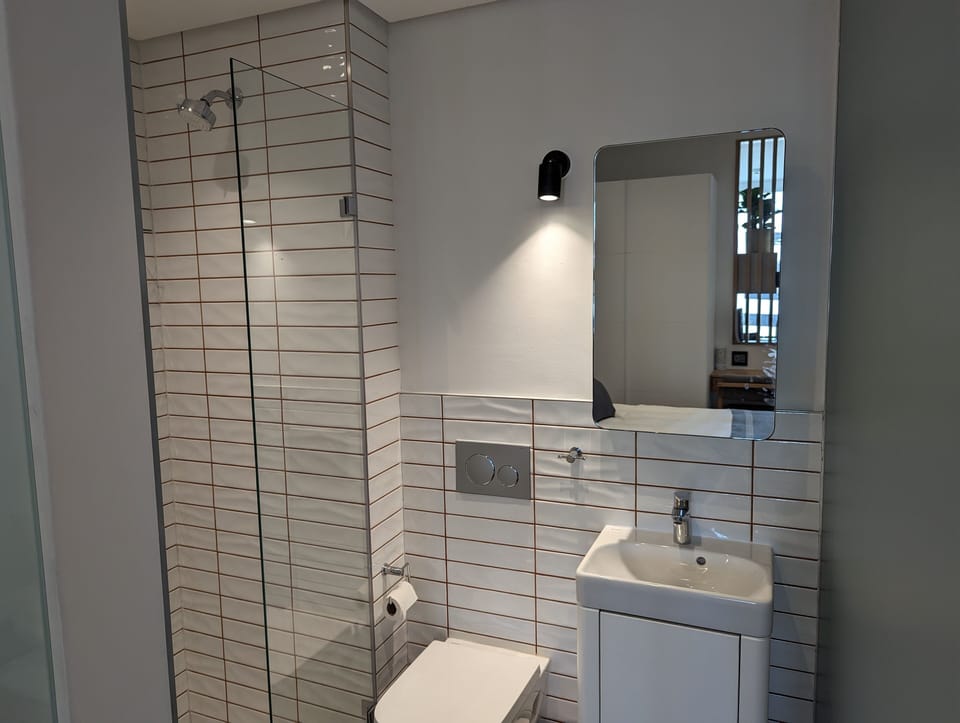 Luxury Studio, City View | Bathroom | Shower, designer toiletries, hair dryer, towels