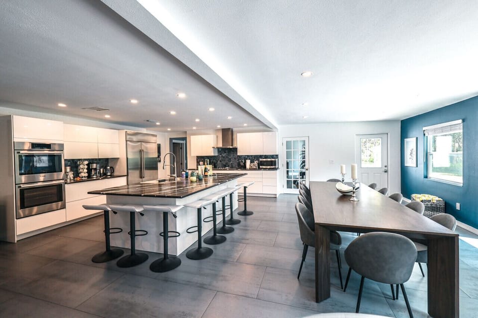 Open concept chef's kitchen and dining area seating 14 + 8