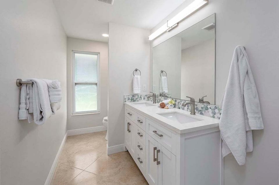Guest Bathroom with Dual Sinks and Shower