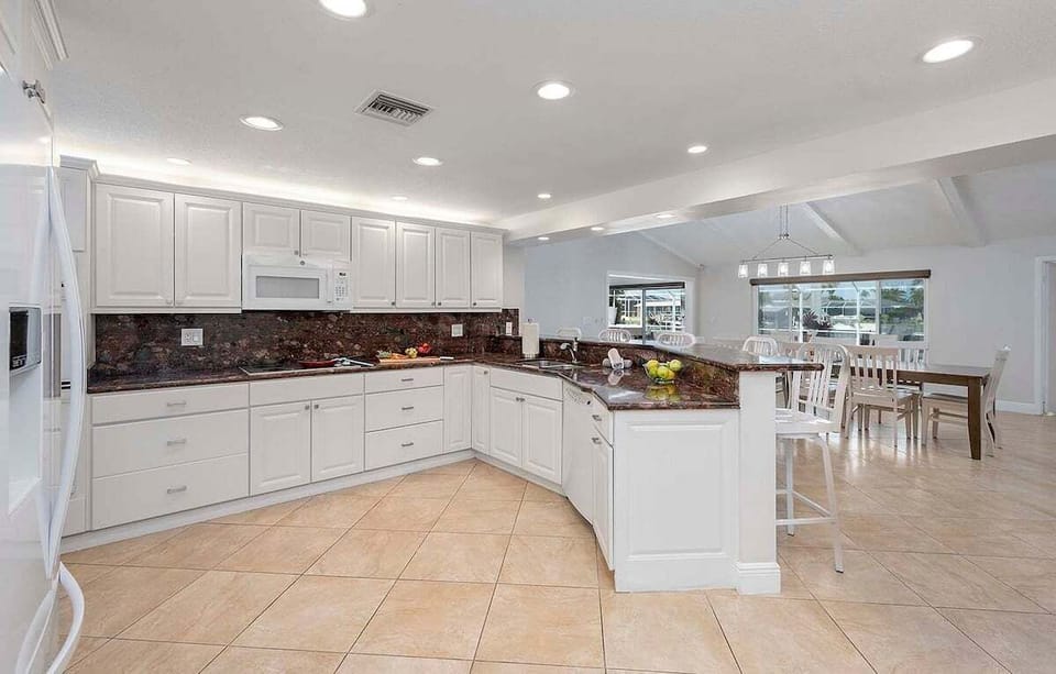 Large Kitchen with Views of Dining Space and Pool