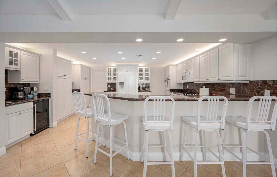 Additional Seating Space at Kitchen Bar Counters and Double Ovens