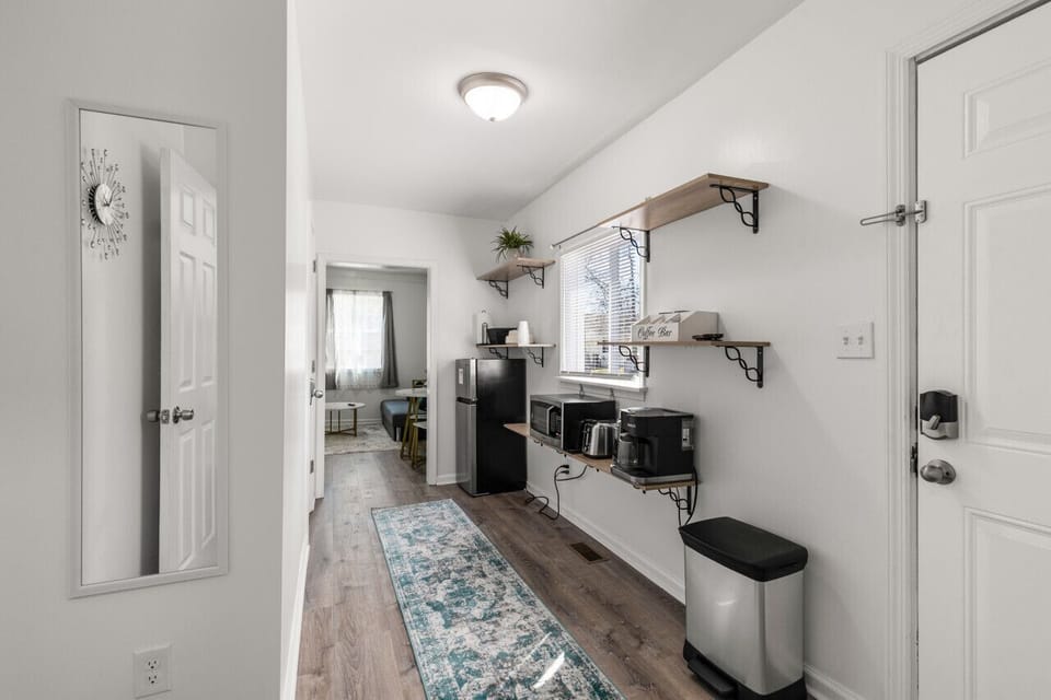 Discover the convenience of our kitchenette, equipped with a Keurig and drip coffee maker combo for your morning brew, a mini fridge with a freezer to store your essentials, toaster and a microwave for quick and easy meals.