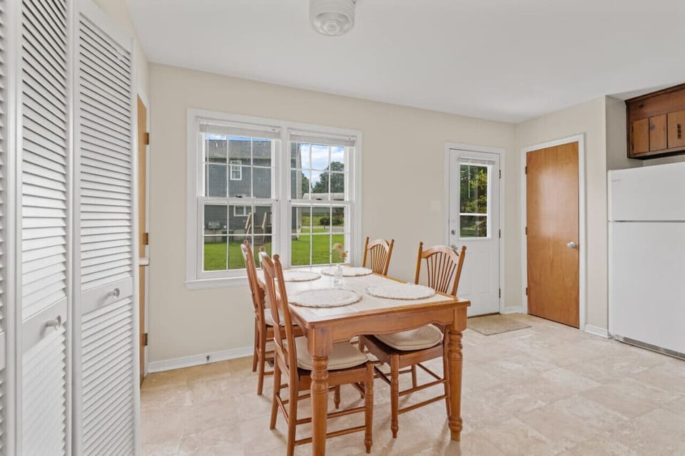 Gather around our kitchen table, comfortably seating four, for delightful home-cooked meals and cherished moments shared with loved ones.