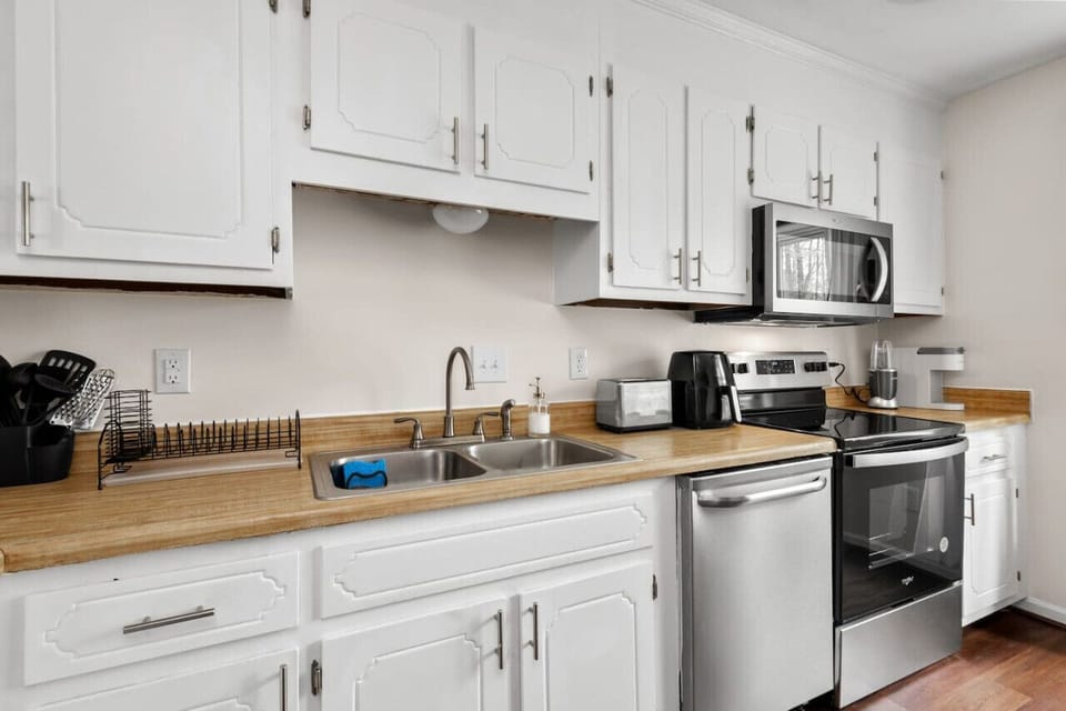We have a fully equipped kitchen featuring a microwave, dishwasher, stove, oven, Keurig coffee maker, and more. It`s conveniently adjacent to the dining area, which comfortably seats four people.