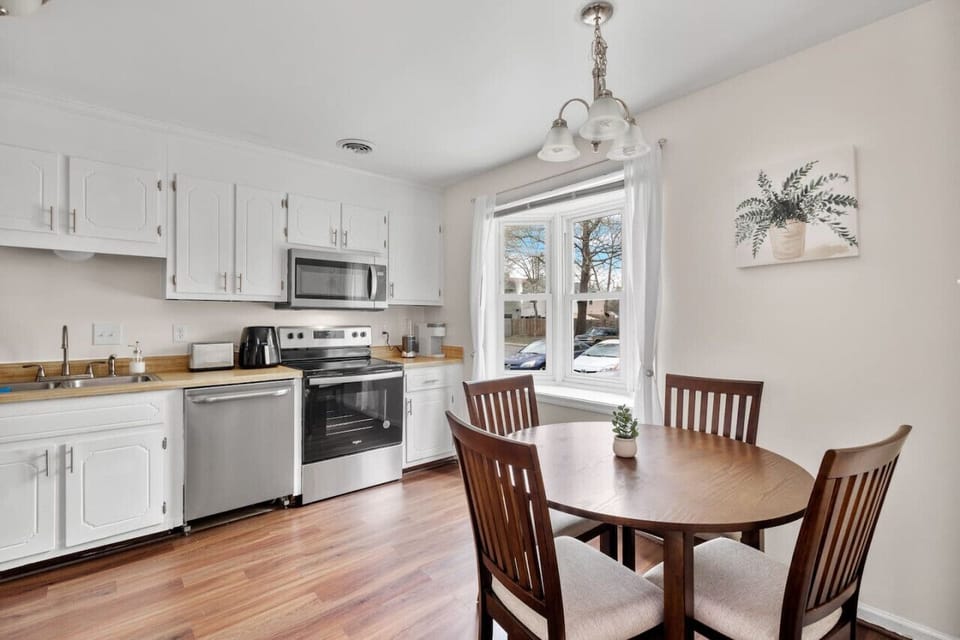 We have a fully equipped kitchen featuring a microwave, dishwasher, stove, oven, Keurig coffee maker, and more. It`s conveniently adjacent to the dining area, which comfortably seats four people.