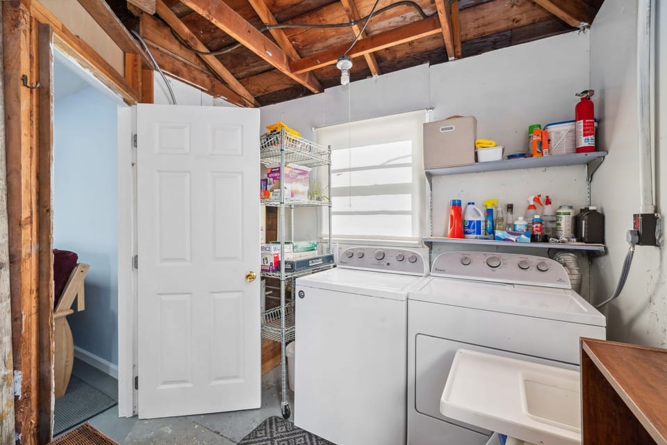 Washer and Dryer laundry room with access to the back yard.