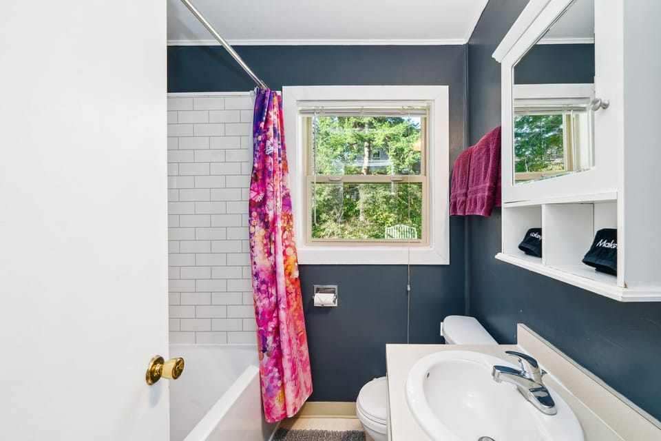 Full bath with deep tub and shower.