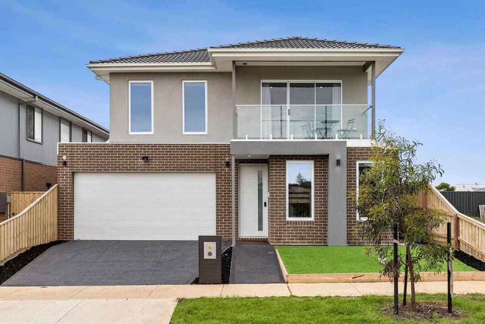 This modern double-story home features a sleek facade, private balcony, double garage, and stylish interiors — perfect for families or friends seeking space, comfort, and contemporary design