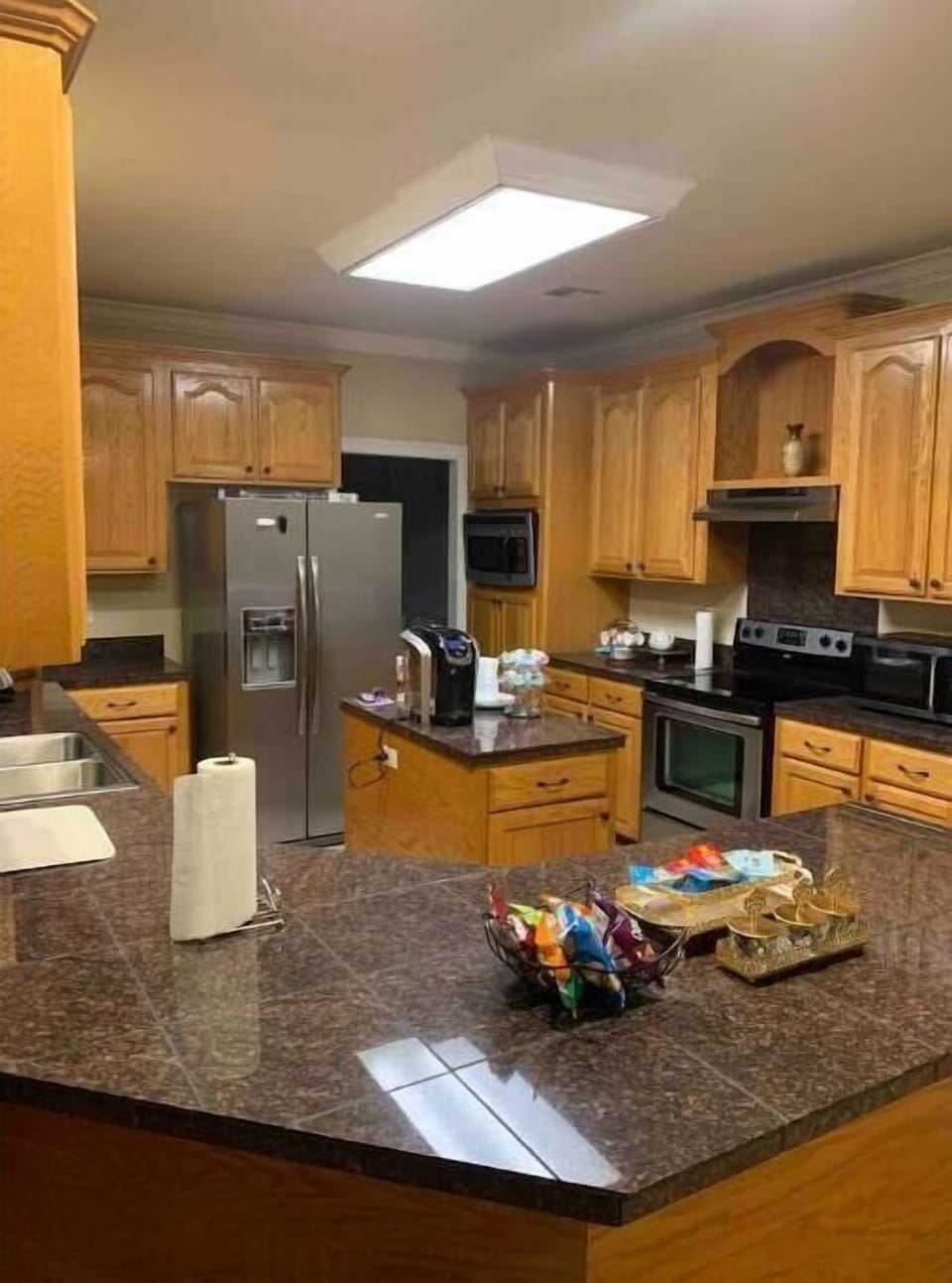 Full Kitchen with refrigerator, oven, stove, dishwasher, coffee machine, toaster