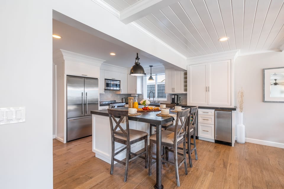 Additional seating at the kitchen island, with 4 barstools.