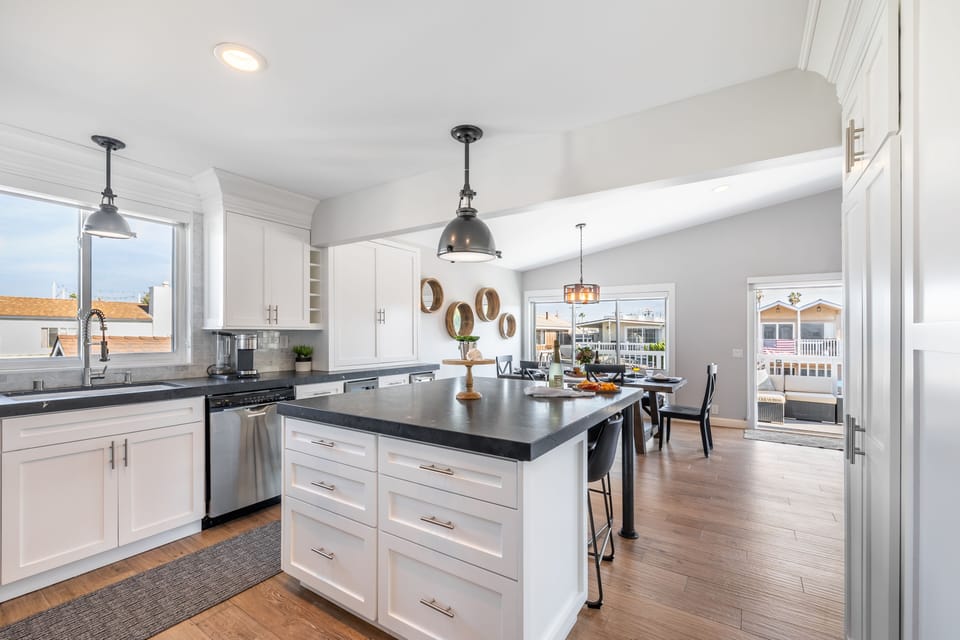 Kitchen is fully equipped and features high-end stainless steel appliances.